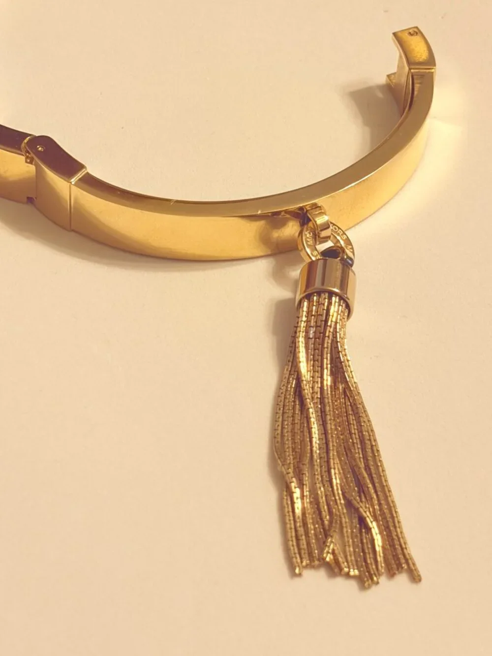 Michael Kors Gold Tone Tassel Hinged Bracelet